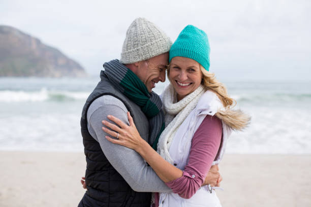 istock Mature couple embracing each other on the beach 655986540