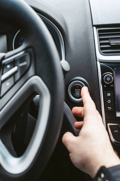 istock Engine start button and finger with shallow depth of field 655986782