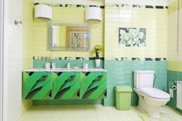 istock Modern bathroom design in green colors with orchid print 655992060