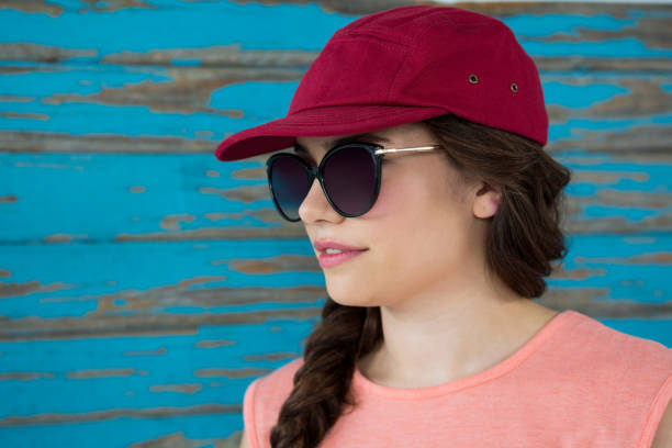 istock Woman in red cap and sunglasses 655994522