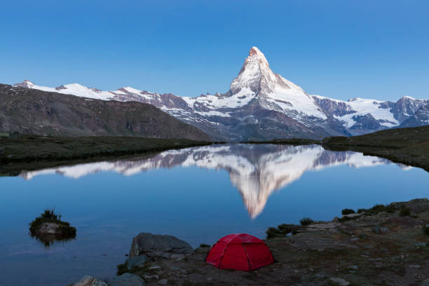 istock Camping at Matterhorn at dawn with Stellisee in foreground 655994994
