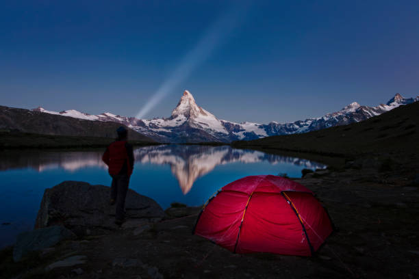 istock Camping at Matterhorn at stary sky with Stellisee in foreground 655995670
