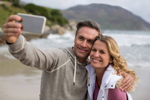 istock Mature couple taking selfie using mobile phone 655999140