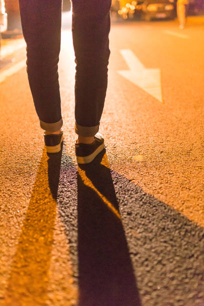 istock female feet on floor at night with lights on 655999332
