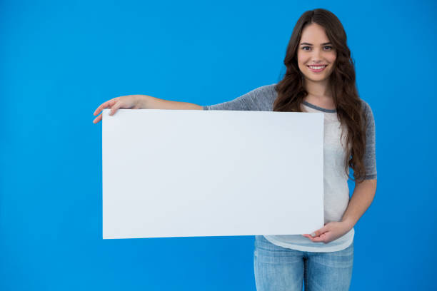 istock Woman holding a blank placard 656002876