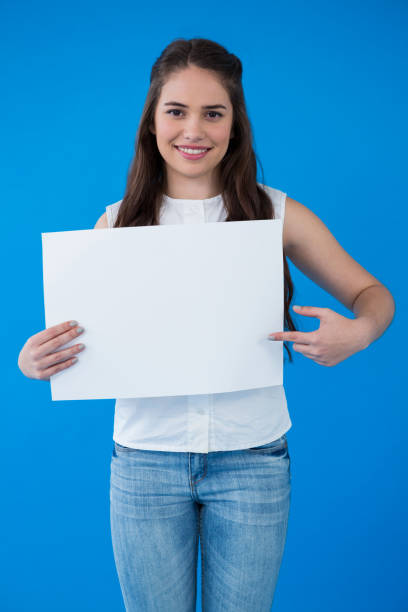 istock Woman holding a blank placard 656002988