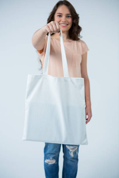 istock Beautiful woman carrying shopping bag 656011668