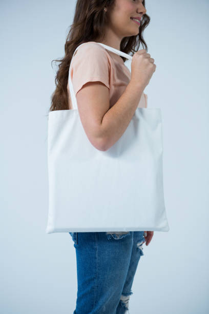 istock Beautiful woman carrying shopping bag 656011676