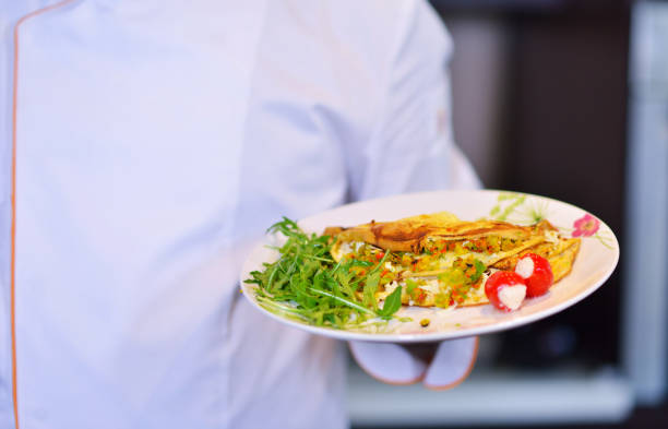 istock Chef starts preparing omelet. Only clean products. 656019178