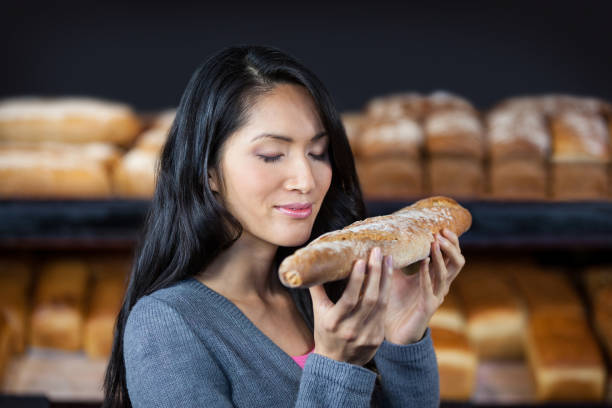 istock Woman smelling a baguette 656019314