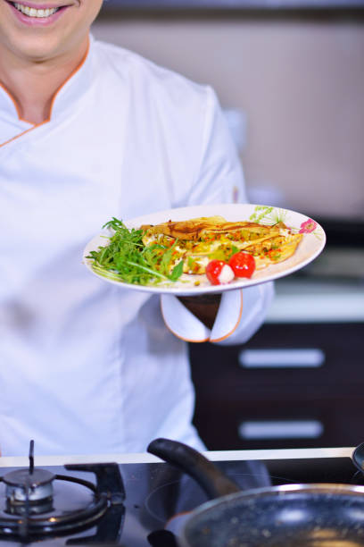 istock Chef starts preparing omelet. Only clean products. 656021992