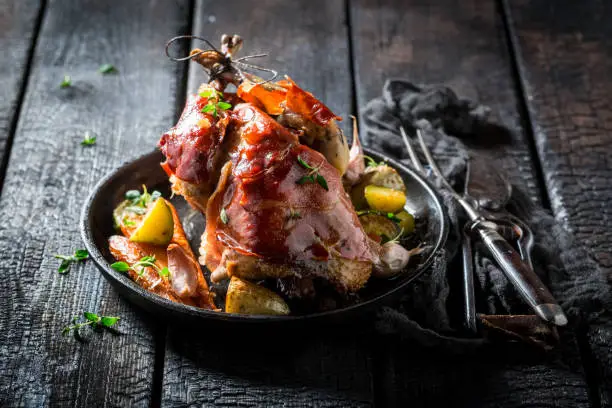 Photo of Grilled pheasant with bacon and spices and vegetables
