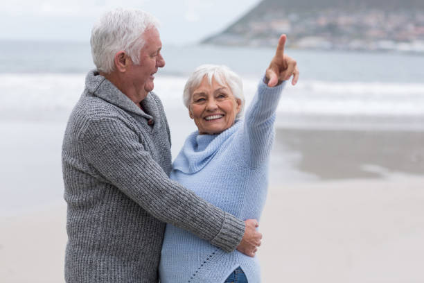 istock Senior couple standing together on the beach 656023126