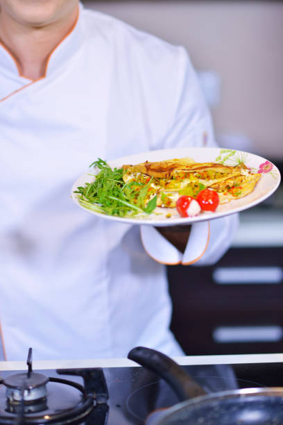 istock Chef starts preparing omelet. Only clean products. 656025388