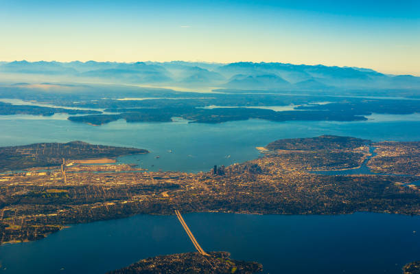 Seattle from air Aerial view of Seattle, Puget Sound, and the Olympic range to the west puget sound photos stock pictures, royalty-free photos & images