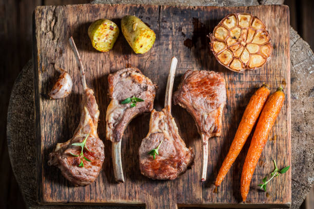 istock Hot roasted lamb ribs on the burnt black table 656029302