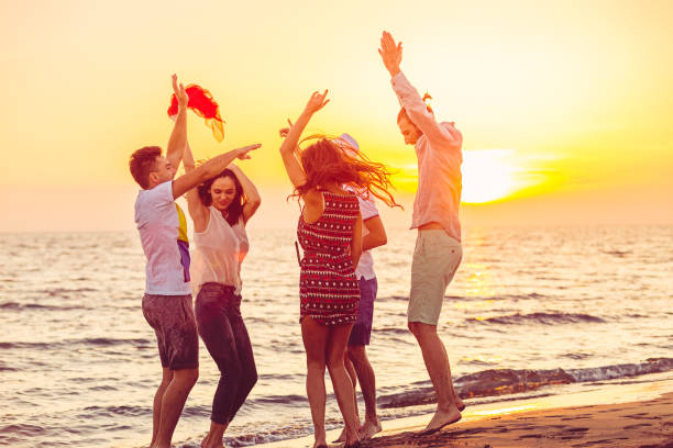 istock Young People Dancing On Beach at Sunset 656031750