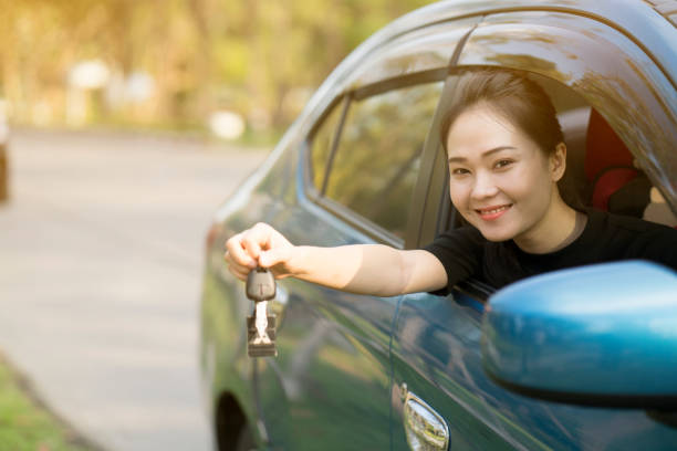 istock young happy woman in car with sunlight 656032964