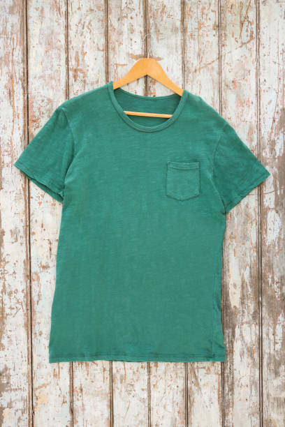 istock Green t-shirt with pocket on hanger 656035368