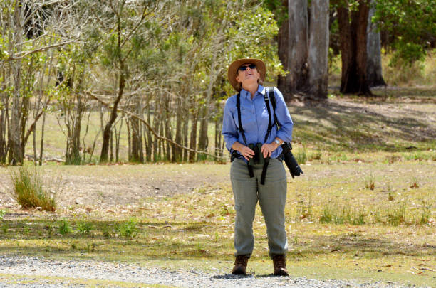 Mature woman birdwatching