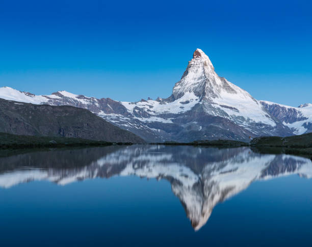 istock Matterhorn at dawn with Stellisee in foreground 656035946