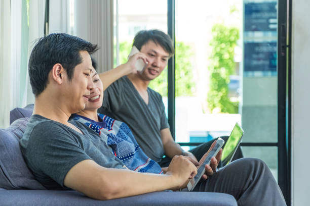 istock Group of people discussion by using mobile phone,tablet ,laptop computer at home,casual meeting,mobile office 656037532