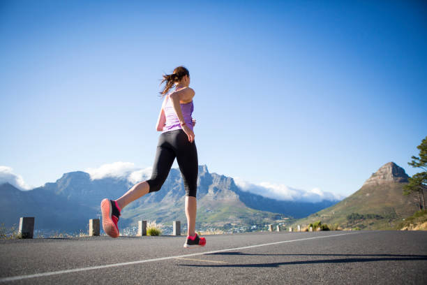istock Woman running along the road 656039942