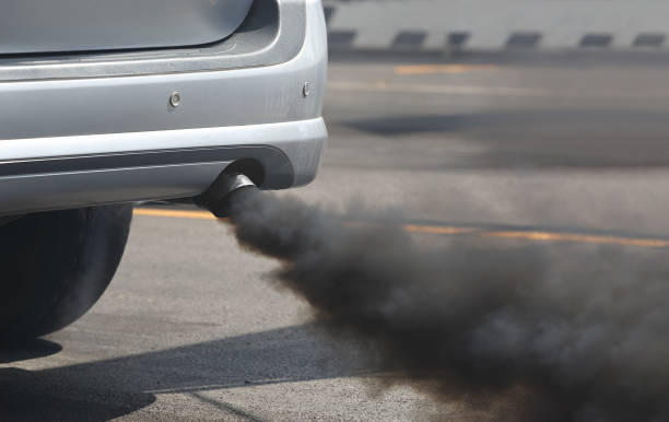 istock Air pollution from vehicle exhaust pipe on road. 656040094