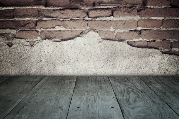 istock old perspective wooden floor and cracked brick wall 656040622