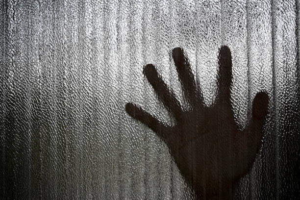 istock Silhouette of a hand the expression to be imprisoned, blur 656049956