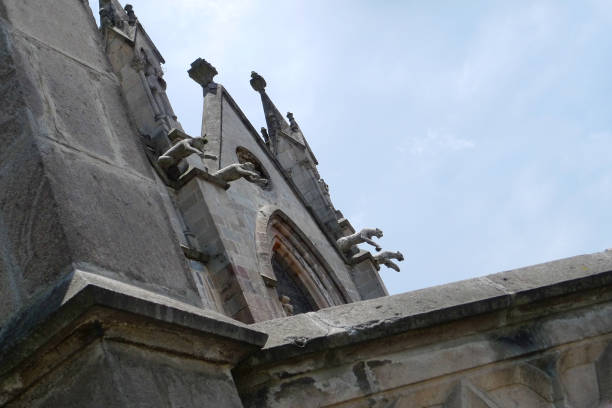 Seville, Spain - January 15, 2024: Close-up of a stone gargoyle part of the exterior architecture in the Seville Cathedral