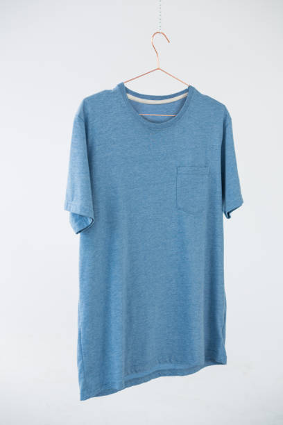 istock Blue t-shirt with pocket hanging on hanger 656057430
