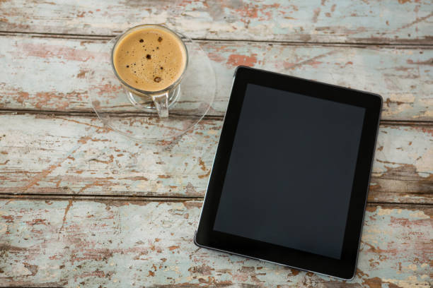 istock Digital tablet and cup of coffee 656057644