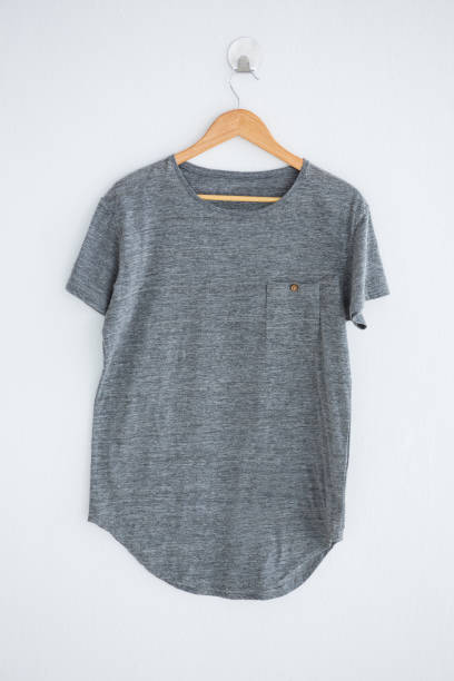 istock Grey t-shirt hanging on wall 656057748