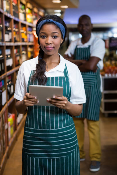 istock Female staff using digital tablet in organic section 656058094