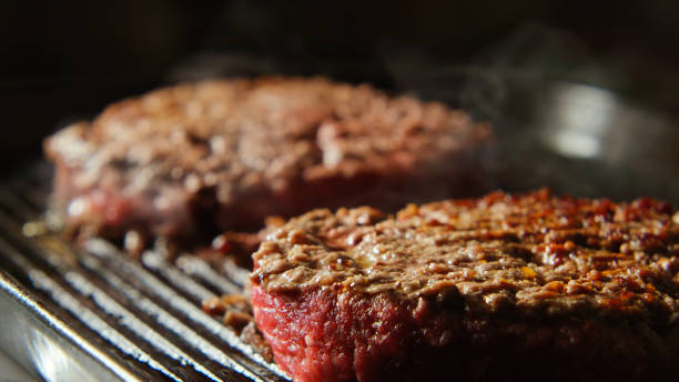 istock Beefsteaks frying on a grill 656064490
