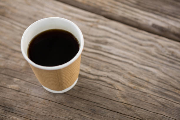 istock Cup of black coffee on wooden table 656067710