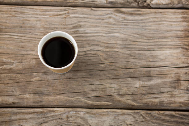 istock Cup of coffee on wooden table 656067712