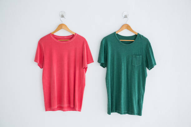 istock Pink and green t-shirts hanging on hanger 656067718