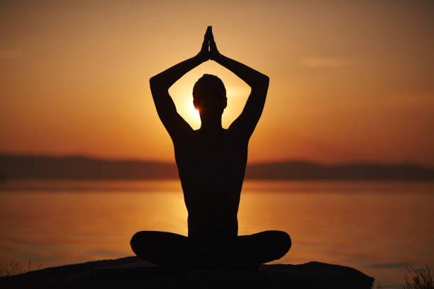 istock Enjoying yoga at sunset 656071596