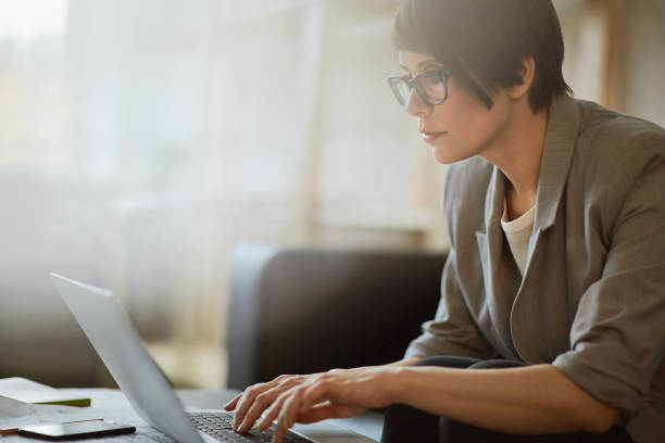 istock Young Confident Woman Working with Laptop 656073084
