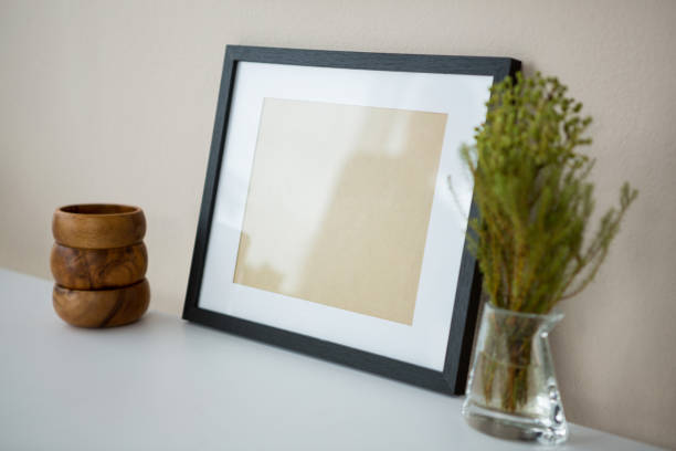 istock Picture frame with wooden pencil holder and vase 656075080