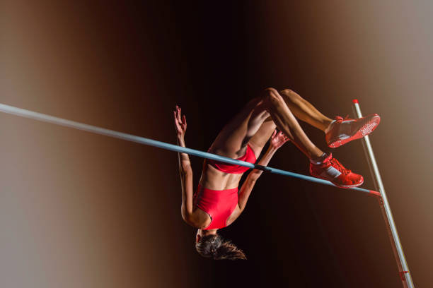 istock Female athlete jumping over a high bar 656078050