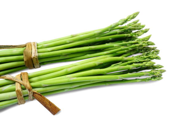 Bundle of fresh asparagus on white background. stock photo