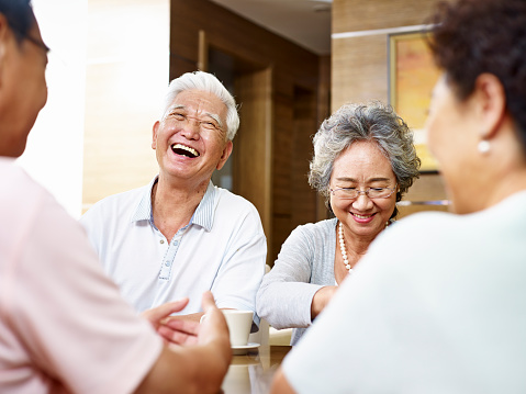 senior asian people getting together and having a good time