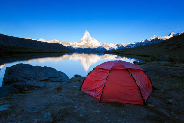 istock Camping at Matterhorn at dawn with Stellisee in foreground 656083204