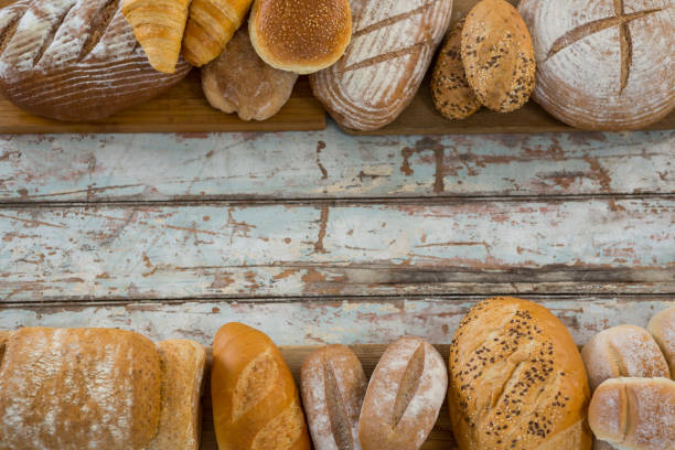 istock Variety of breads arranged on wooden plank 656085544