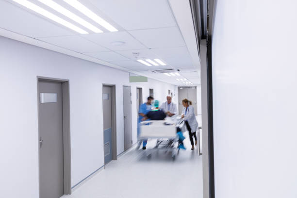 istock Doctors and nurse pushing emergency stretcher bed in corridor 656086564