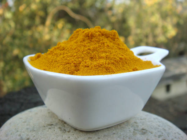 istock Turmeric powder in white bowl 656093148