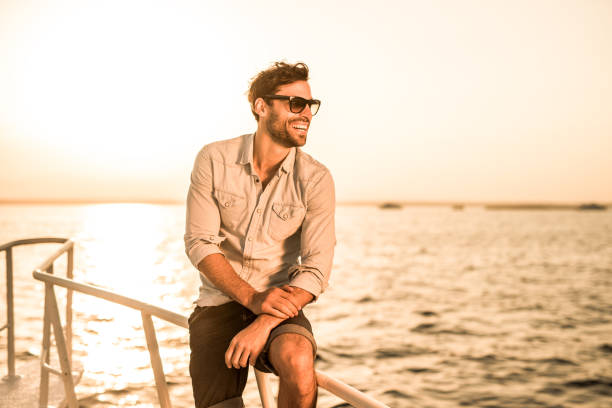 istock Young happy man enjoying in summer day at sunset. 656094342
